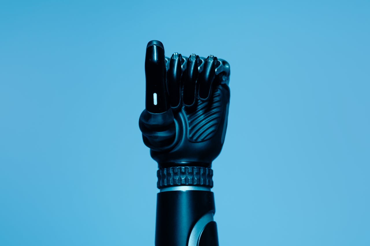 Close-up of a prosthetic arm in a vibrant blue setting, showcasing advanced technology.